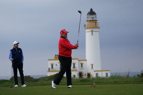 <p>Donald Trump playing golf at his Turnberry course in South Ayrshire in 2023 (PA)</p>
