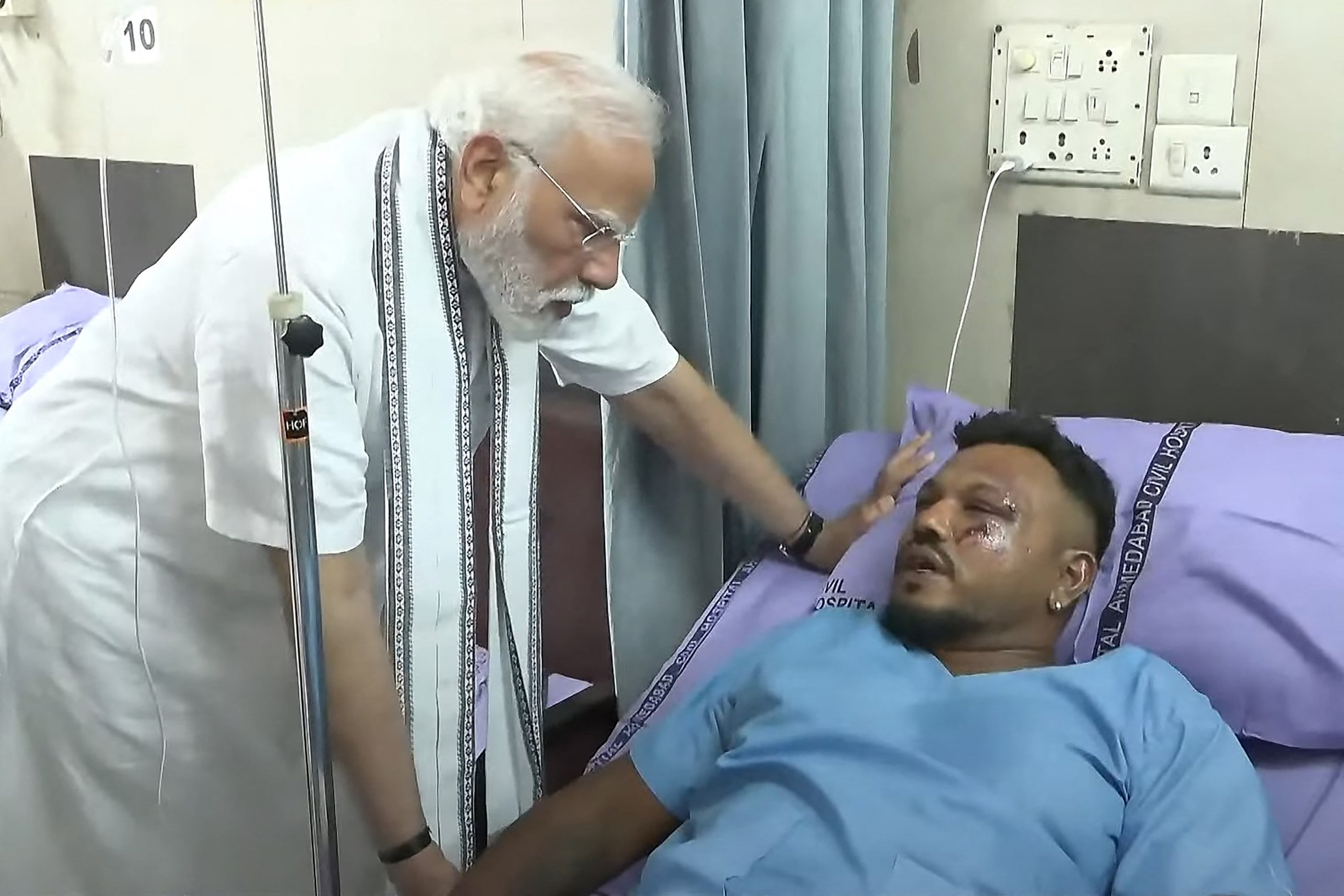 India’s prime minister Narendra Modi meets with Vishwash Kumar Ramesh, sole survivor of the Air India flight 171 crash, at a hospital in Ahmedabad